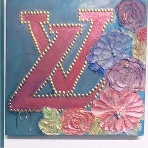 Plaster art on canvas . Louise Vuitton symbol 18x16